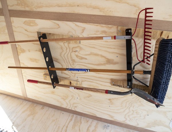 Hand tool rack for enclosed