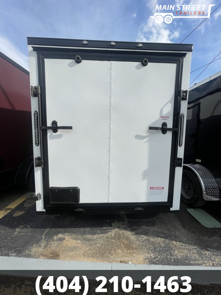 6X10 S/A WHITE B/O WITH RAMP GATE AND SIDE DOOR AND BAR LOCK