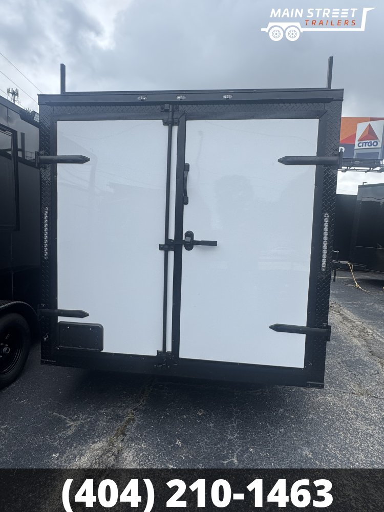 7X14 T/A WHITE B/O, BARN DOORS WITH 3 LADDER RACK AND LADDER