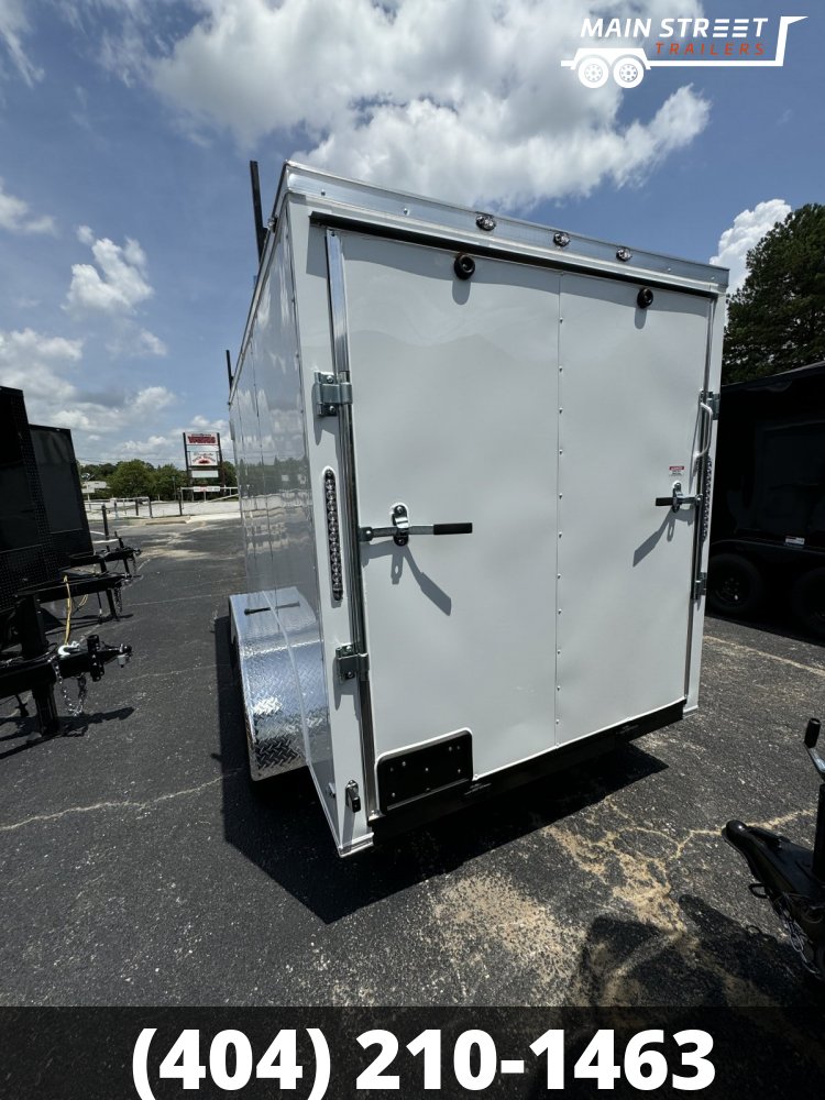 6X12 T/A WHITE WITH LADDER RACKS AND RV AND BARLOCK