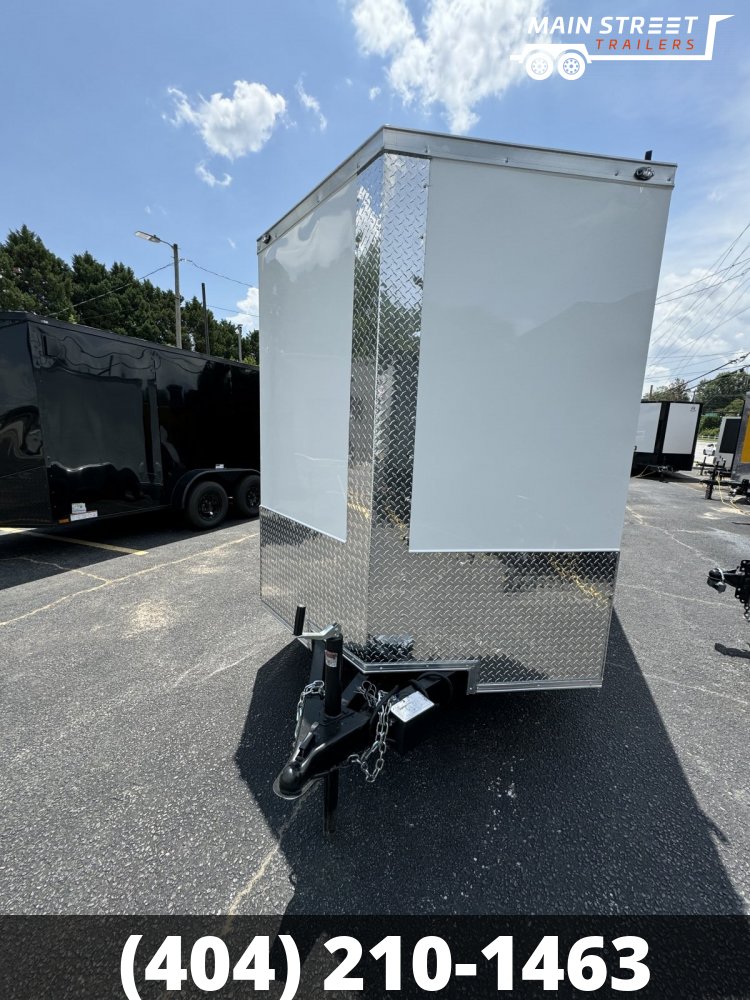 6X12 T/A WHITE WITH LADDER RACKS AND RV AND BARLOCK