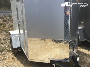 2026 Covered Wagon Enclosed 5 x 8 S/A 24" Side door, Rear Ramp, Side Barlock Silver Frost