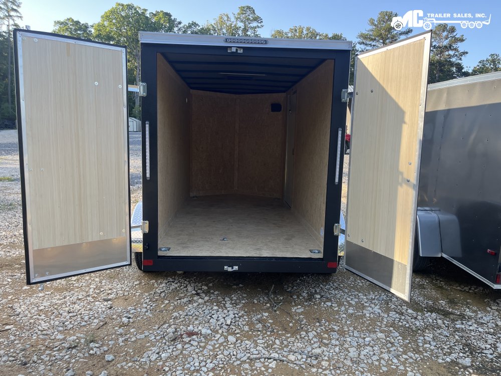 2025 Covered Wagon Enclosed 6 X 12 T/A White barn doors diamond fenders
